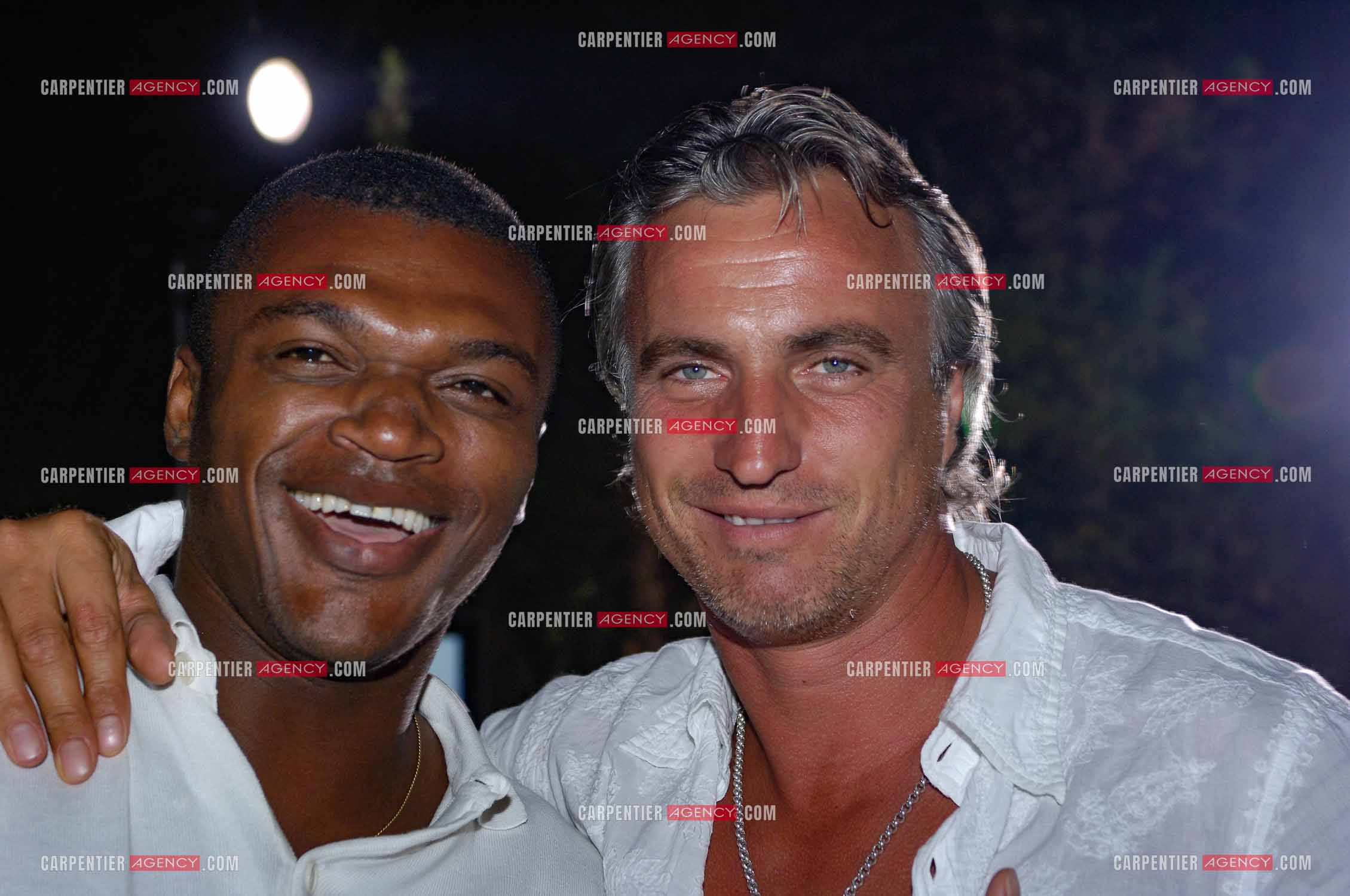 Marcel Desailly et David Ginola lors de la soirée Blanche en 2006.   ( Exclusif )